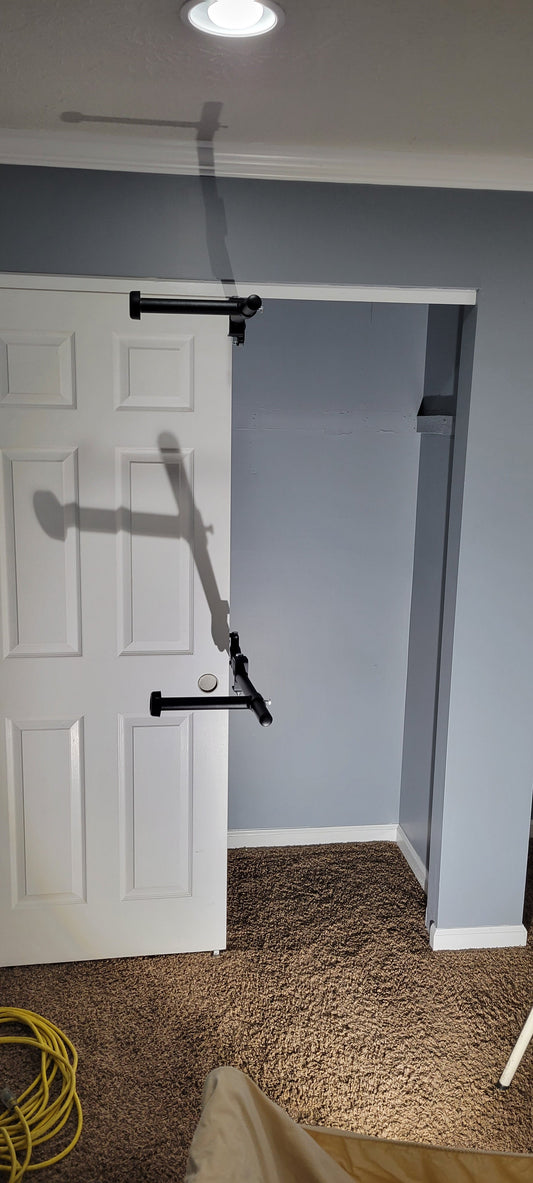 Clever Closet Rod System installed in a reach-in closet showcasing rotating rods for optimal organization and accessibility.