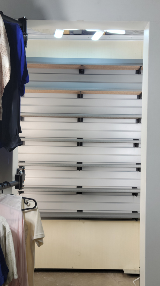 Image of a modern apartment closet transformed with the Be Clever Closet Rod System, showing organized space with easy access for all.